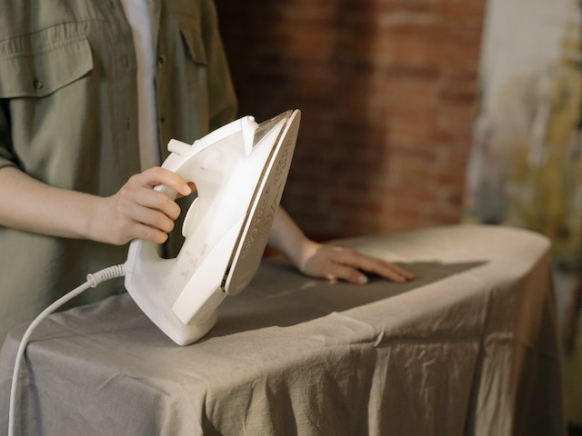 A person ironing