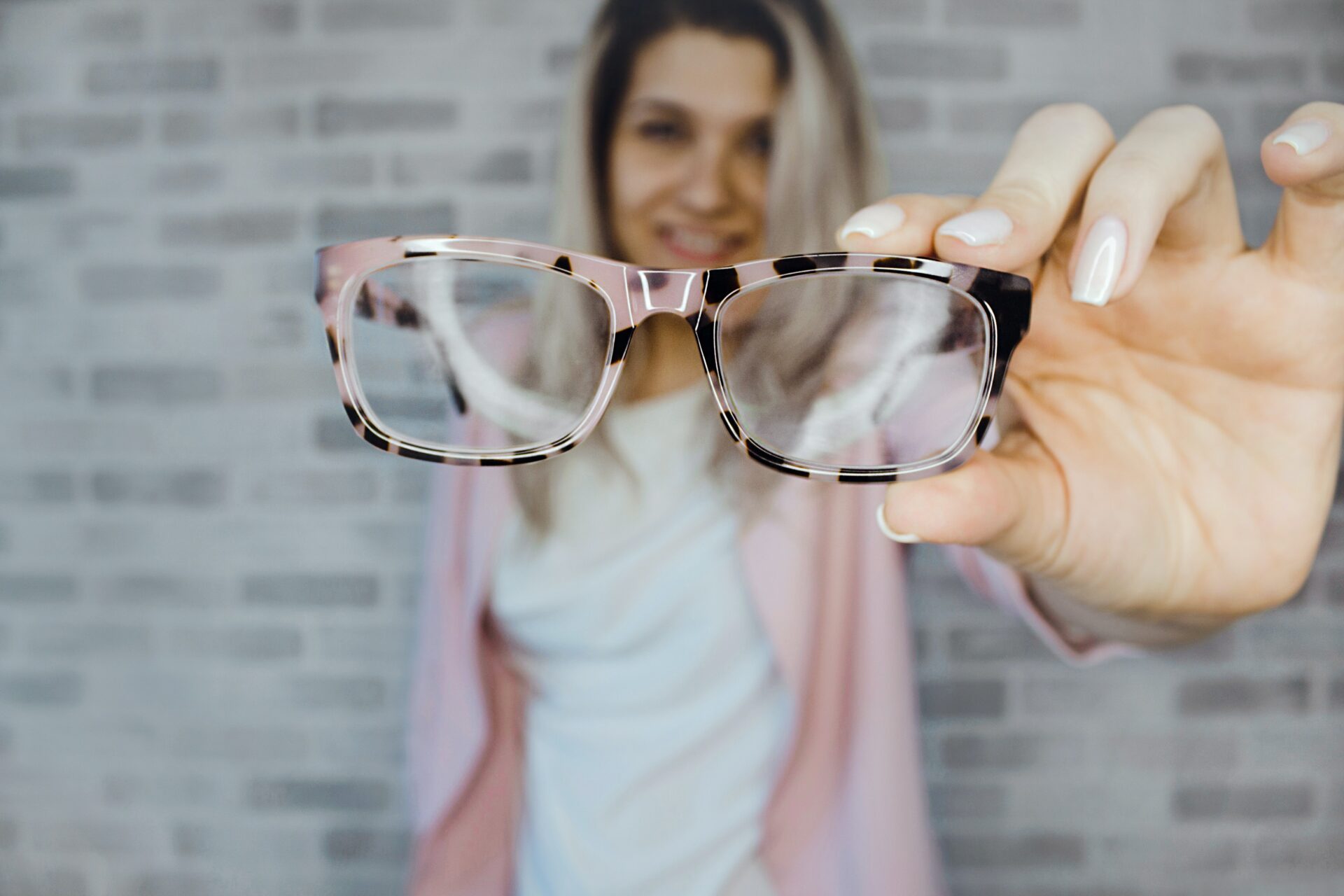 Woman holding glasses