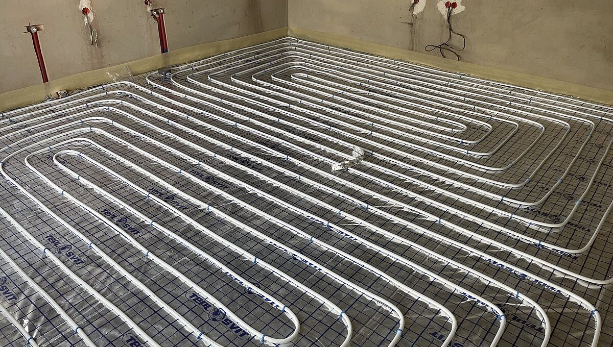 A room with a ground source heat pump that helps save money by providing radiant floor heating.