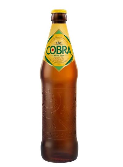 A bottle of cobra beer with a label indicating it is a world beer award winner.