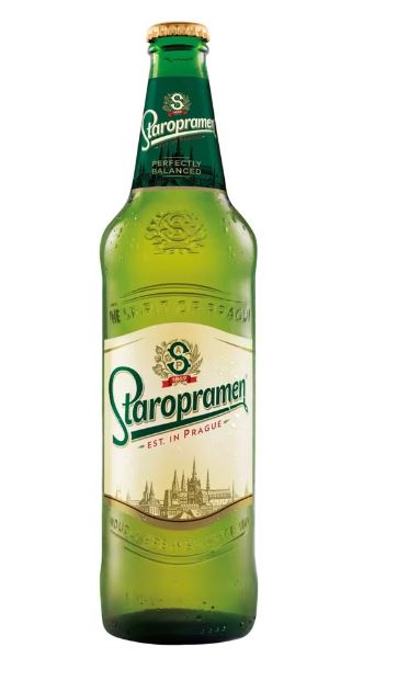 A bottle of staropramen beer with a green label and cap.