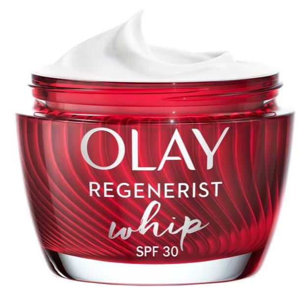 A red jar of Olay Regenerist Whip SPF 30 face cream with a white swirl of product visible on top.