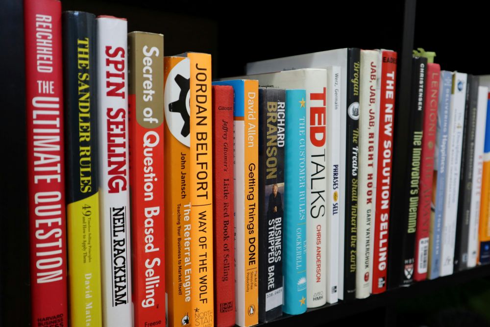 Apps that help you sell things A row of business and self-help books on a shelf, including titles on sales, motivation, and personal development.