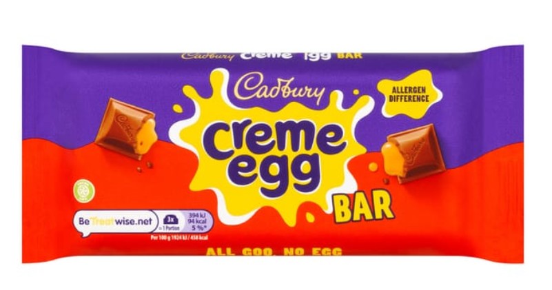 Creme Egg chocolate bar Cadbury Creme Egg Bar packaging with red and purple colors, chocolate pieces, and a yellow splash design. Text reads: "Creme Egg BAR" and "All Goo, No Egg.