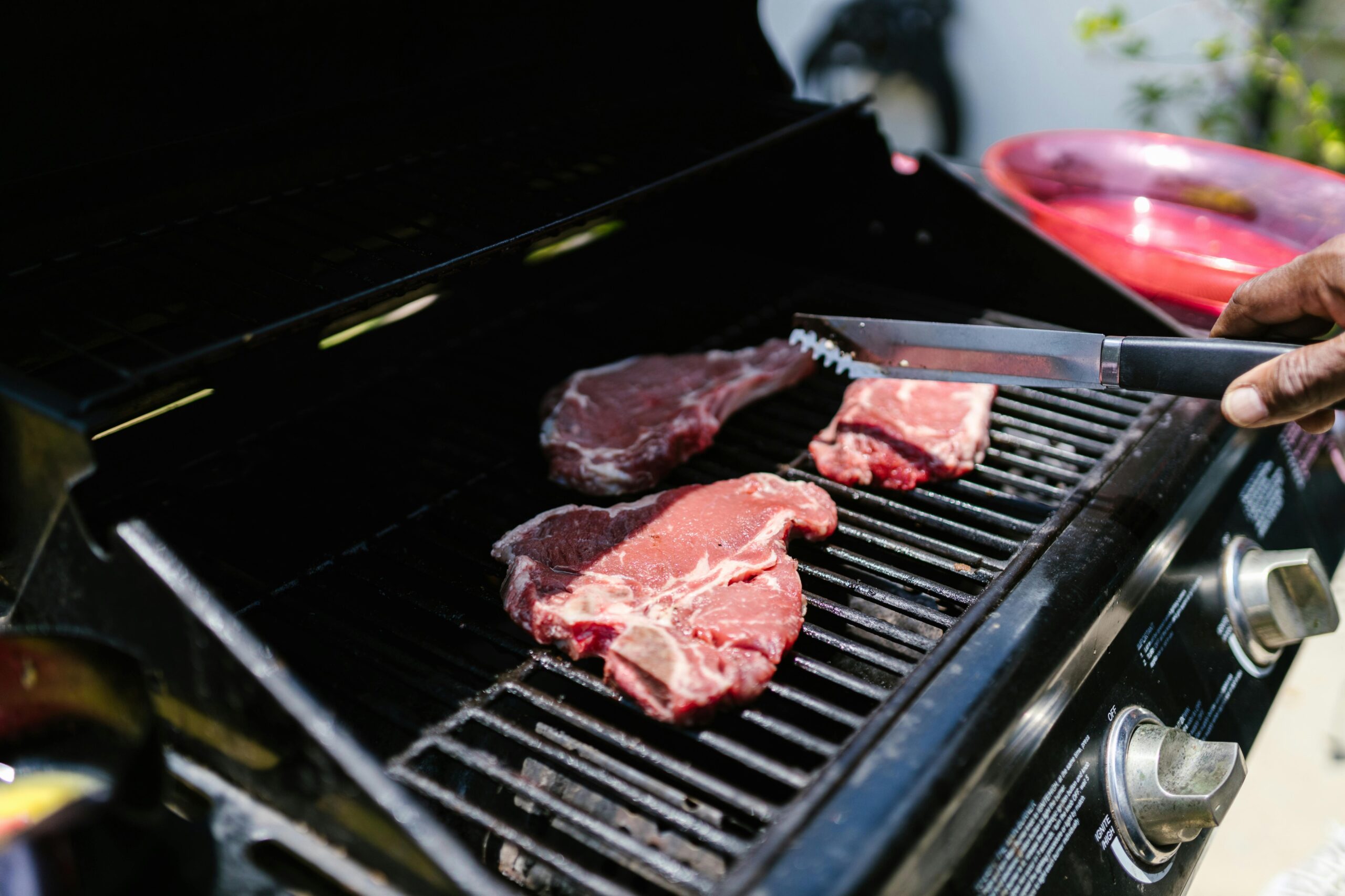 Gas barbecue grill Steak being cooked on a gas BBQ grill