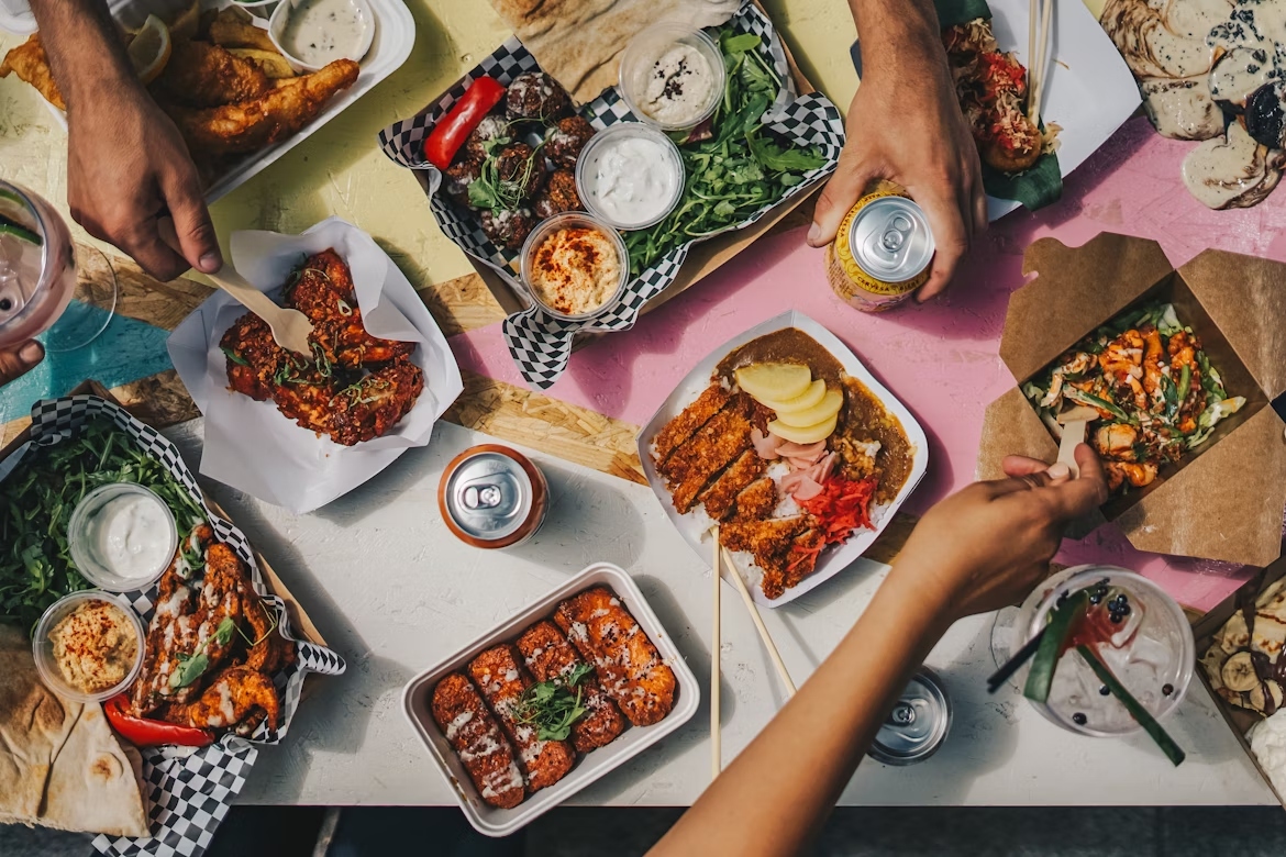 Group takeaway A group of friends splitting a takeaway between themselves for cheap eats