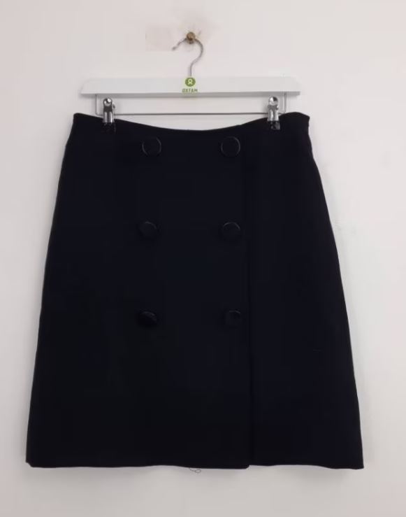 A black, knee-length skirt with six large buttons down the front, displayed on a white hanger against a plain white background.