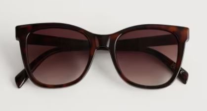 A pair of oversized square sunglasses with dark, gradient lenses and a brown tortoiseshell frame.