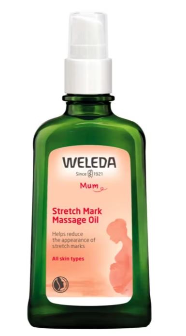 A green bottle of Weleda Stretch Mark Massage Oil with a pump dispenser, labeled for all skin types and designed to help reduce the appearance of stretch marks.