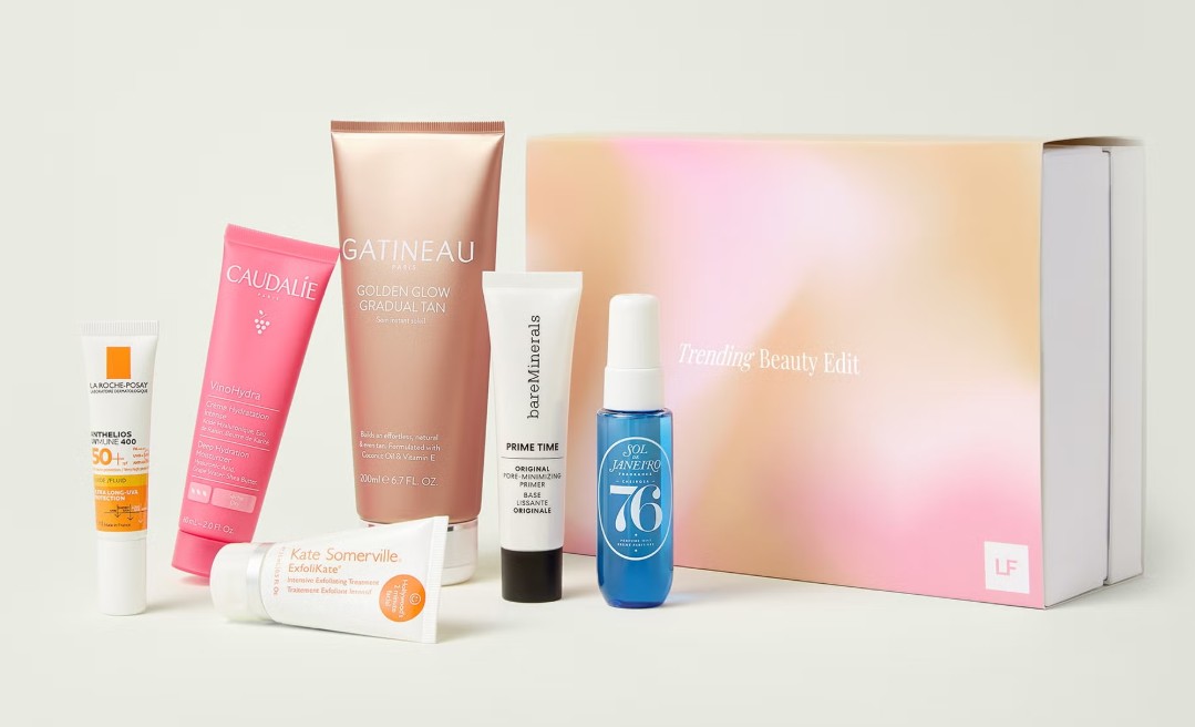 A selection of six skincare and beauty products is displayed standing next to a pastel-colored "Trending Beauty Edit" box.
