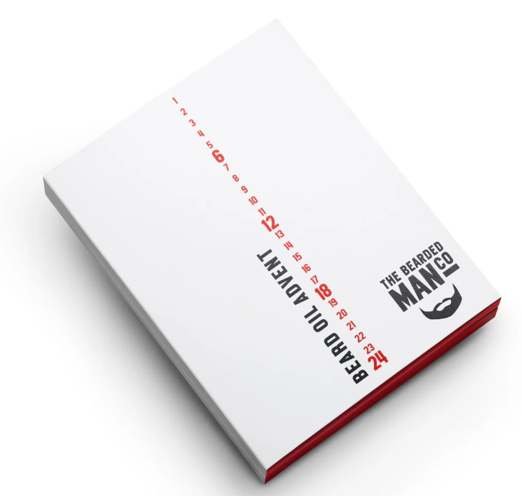 A white box labeled "Beard Oil Advent" with numbers in red and "The Bearded Man Co" logo in black on the cover.