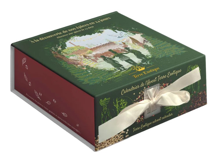 A rectangular green and red box with a ribbon, featuring an illustrated scene and labeled "Calendrier de l'Avent Terre Exotique.