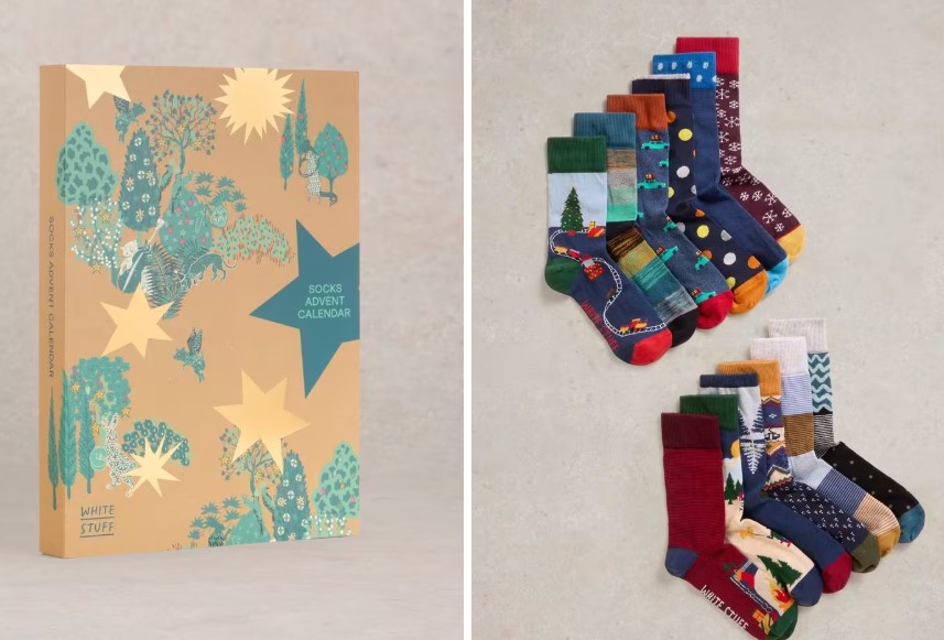 A box labeled "Socks Advent Calendar" and twelve pairs of colorful patterned socks are displayed side by side.