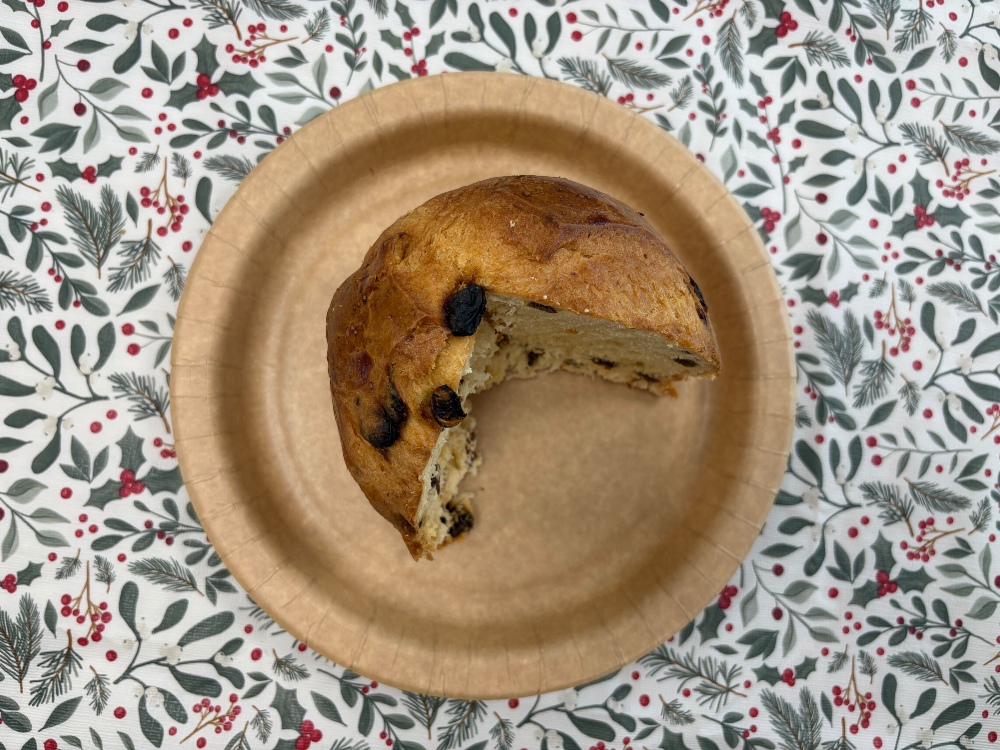 A top-down view of a sliced Co-op panettone on a plate
