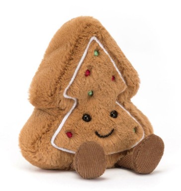 A plush toy shaped like a brown Christmas tree with embroidered sprinkles, a smiling face, and soft brown feet, set against a white background.