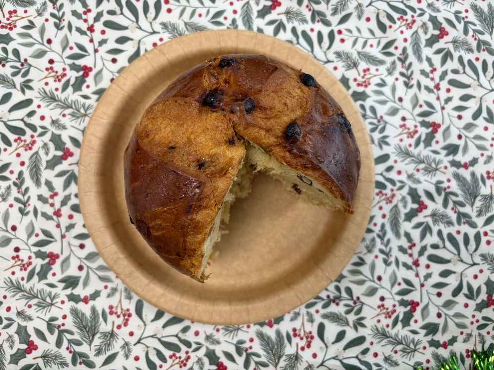 A top-down image showing an M&S supermarket panettone with a slice taken out of it
