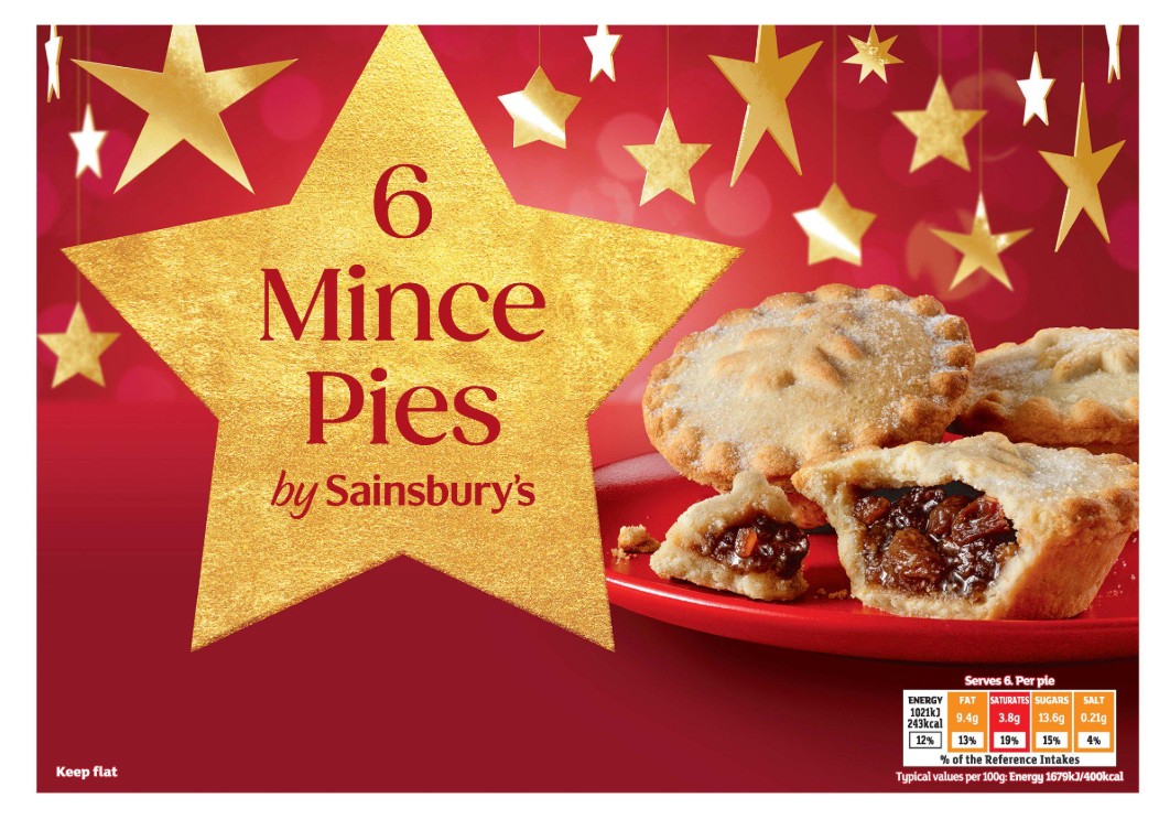 A red plate with six mince pies in front of a red background with gold stars and the text "6 Mince Pies by Sainsbury’s." Nutritional information shown in the bottom right corner.