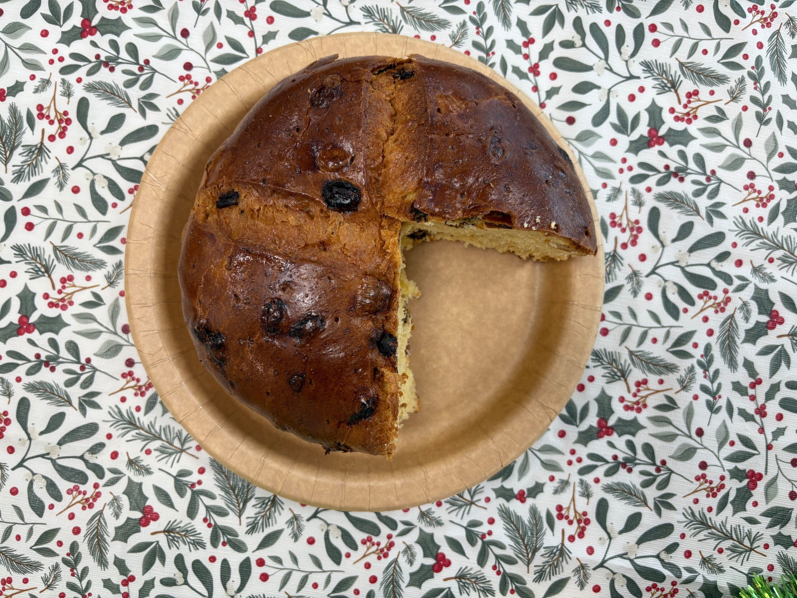 A top-down view of a Waitrose panettone with a slice taken out of it