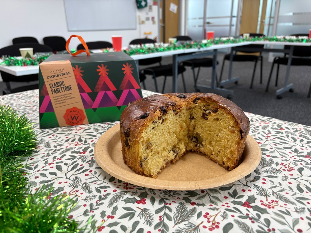 An image showing a sliced Waitrose panettone sitting next to its box