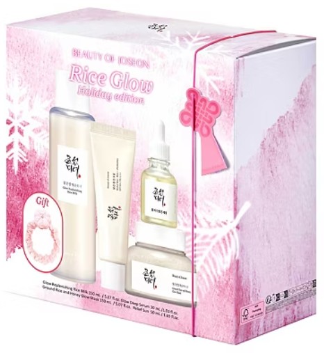 Beauty Of Joseon Rice Glow Holiday Edition A boxed set of Beauty of Joseon Rice Glow Holiday Edition skincare products, including bottles, tubes, and a gift item, with pink and white festive packaging.