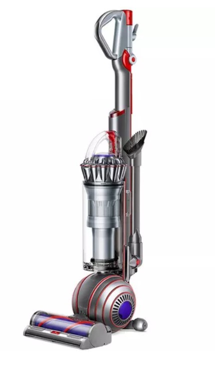 DYSON Ball Animal Origin Upright Bagless Vacuum Cleaner A modern upright vacuum cleaner with a transparent dust bin, red and gray accents, and attached cleaning tools stands on a white background.