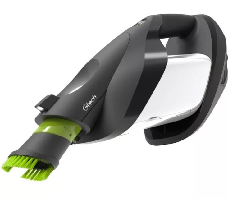 Gtech ProLite Lightweight Handheld Vacuum A handheld vacuum cleaner with a green-bristled brush attachment and a black and white body, shown in a close-up side view.