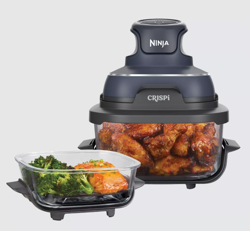 NINJA CRISPi 4-in-1 Portable Air Fryer A Ninja CRISPI kitchen appliance filled with cooked chicken wings is shown beside a glass tray containing cooked broccoli and carrots.