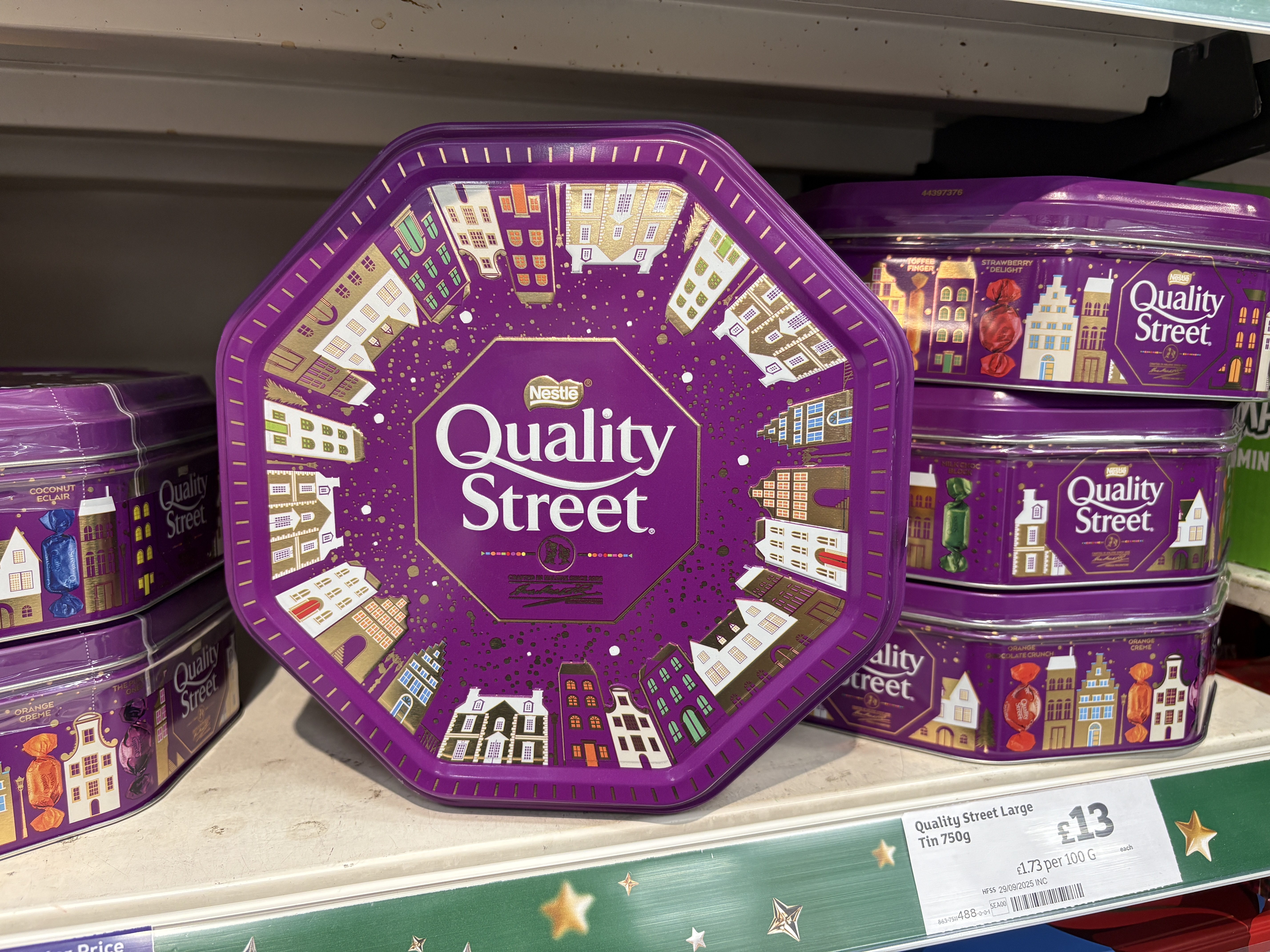 An image showing a series of Quality Street supermarket tubs of chocolates for Christmas