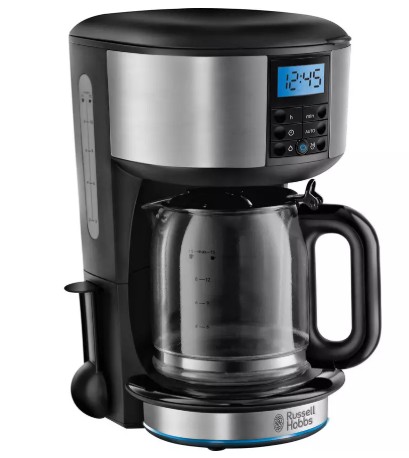 A digital drip coffee maker with a glass carafe, control panel, LCD display showing 12:45, and Russell Hobbs branding on the base.