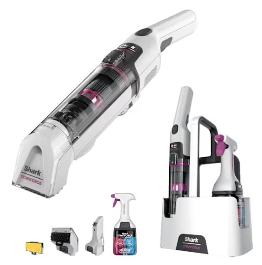 Shark StainForce Cordless Stain-Destroying Spot Cleaner HX100UKT A white Shark handheld vacuum cleaner with cleaning attachments, a spray bottle, and a docking station set against a plain background.