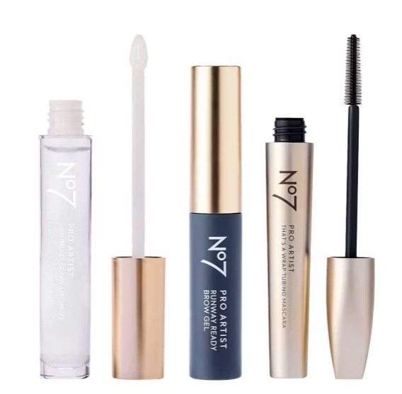 Four No7 makeup products: a lip gloss with a white applicator, a closed brow gel tube, and a tube of mascara with its black wand exposed.