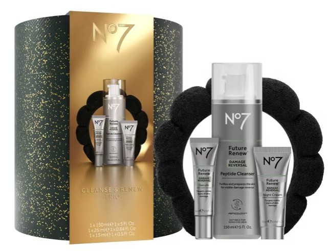No7 Cleanse & Renew Trio gift set, featuring three skincare products and a black scrunchie, displayed in front of a black and gold cylindrical package.