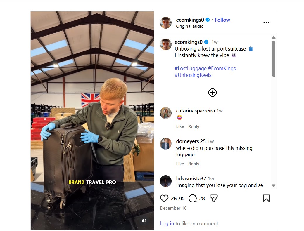 A person wearing blue gloves unboxes a black suitcase labeled "Brand Travel Pro" inside a warehouse with shelves of luggage in the background.