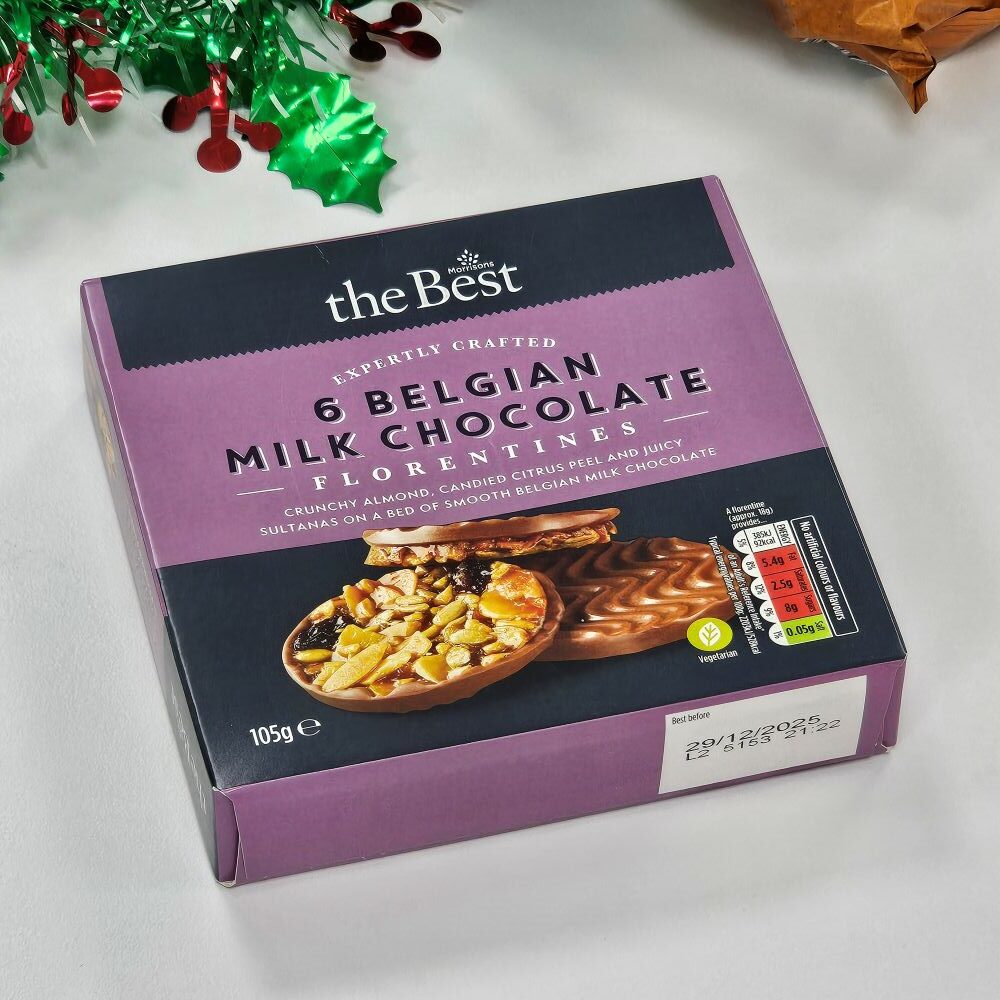 tcb morrisons the best milk chocolate florentines A box of "the Best" Belgian Milk Chocolate Florentines, containing six pieces, displayed on a white surface with festive green and red decorations in the background.