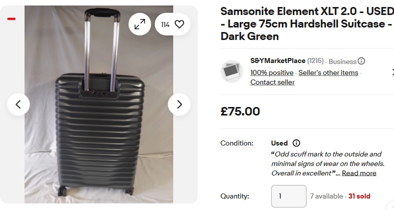 A large, dark green hard-shell suitcase with a ribbed design and extended telescopic handle, standing upright on four wheels against a plain background.