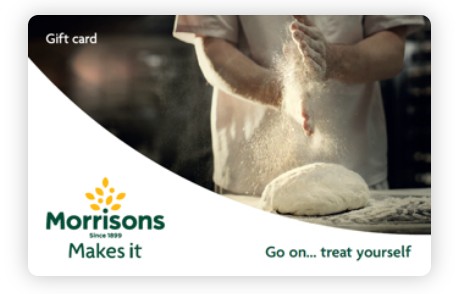 Close-up of a person dusting flour over dough, with the Morrisions logo and the text "Makes it" and "Go on... treat yourself" on a gift card.