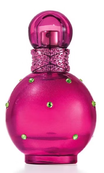 britney spears parfum A round, bright pink perfume bottle with green gem-like accents and a matching pink cap, photographed against a white background.