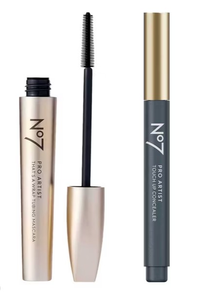 Two No7 Pro Artist makeup products: an open gold mascara tube with a visible wand, and a closed gray touch-up concealer stick with a gold cap.