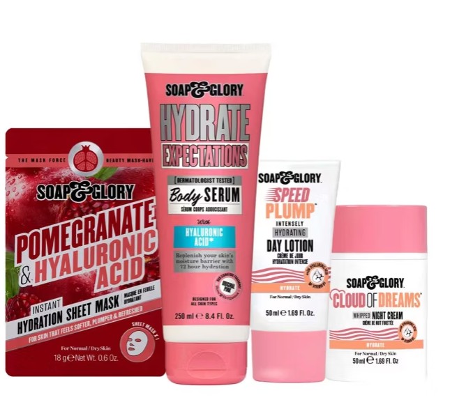 soap and glory Four Soap & Glory skincare products are arranged side by side, including a sheet mask, body serum, day lotion, and night cream, all labeled with hydration-focused ingredients.