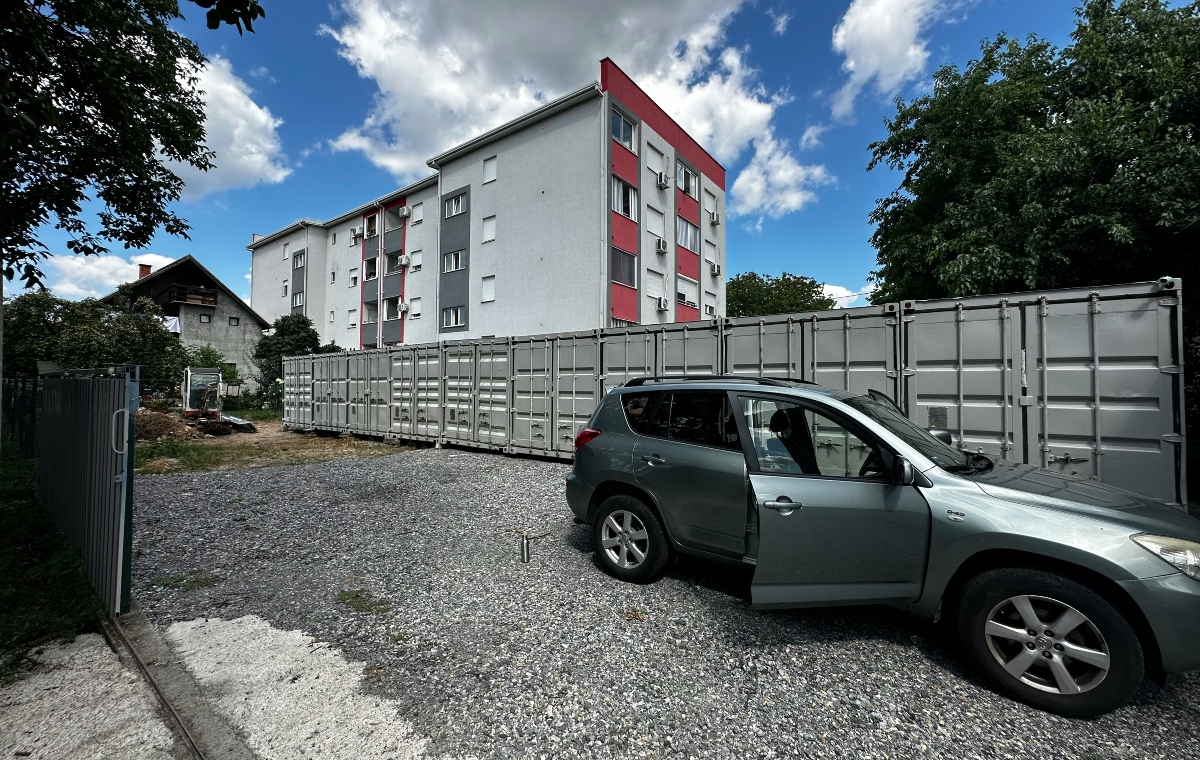 Storage locker car An image showing a grey car driven to a storage locker auction