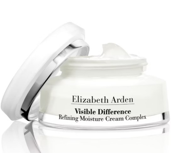 elizabeth arden cream An open jar of Elizabeth Arden Visible Difference Refining Moisture Cream Complex with the lid tilted beside it, showing white cream inside.