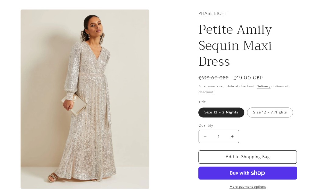 girl meets dress desktop Woman wearing a long, silver sequin maxi dress with long sleeves, holding a clutch bag, standing against a plain light-colored wall.