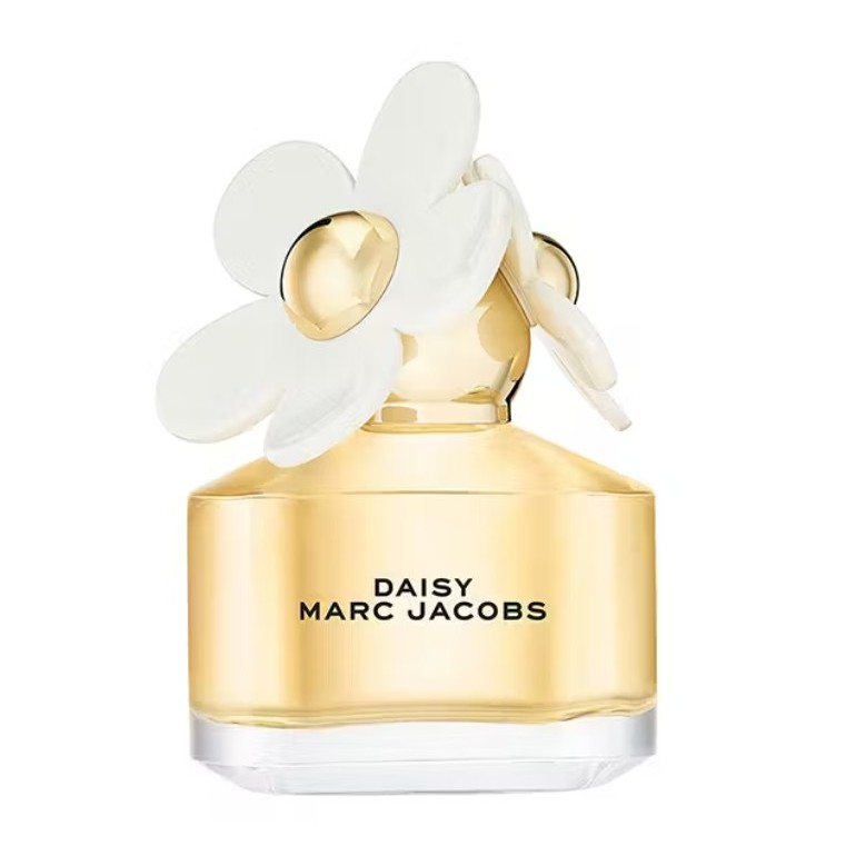 A bottle of Daisy by Marc Jacobs perfume with a gold cap decorated with white daisy-shaped flowers.
