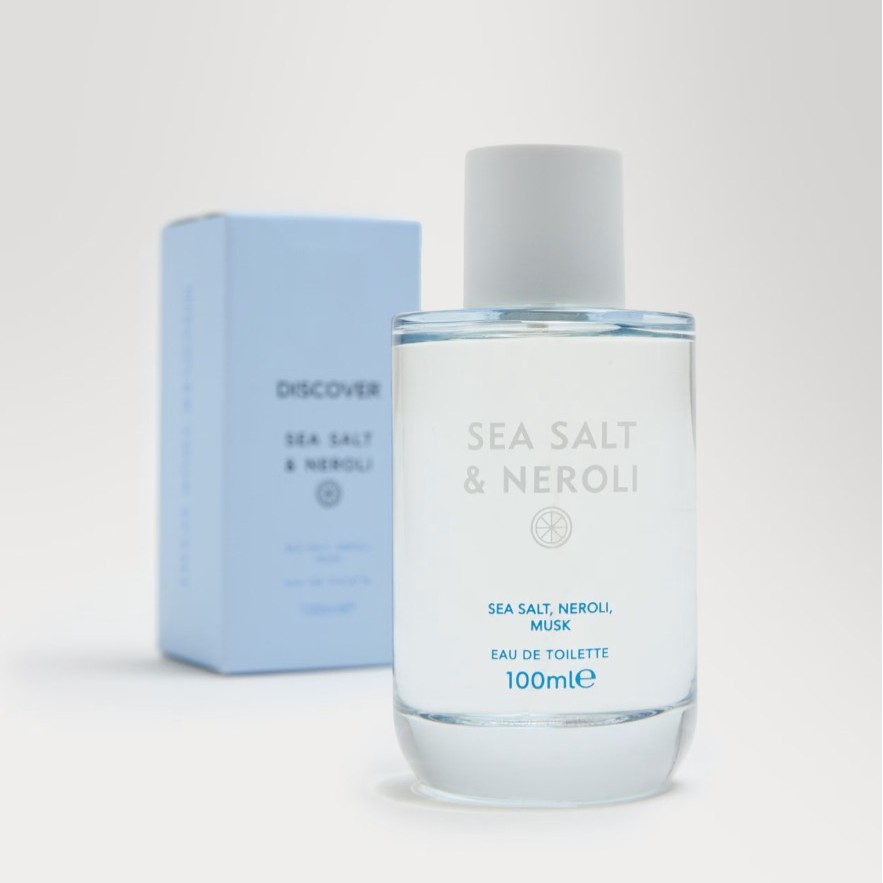 A clear glass bottle labeled "Sea Salt & Neroli" Eau de Toilette, 100ml, is displayed in front of a matching light blue box.