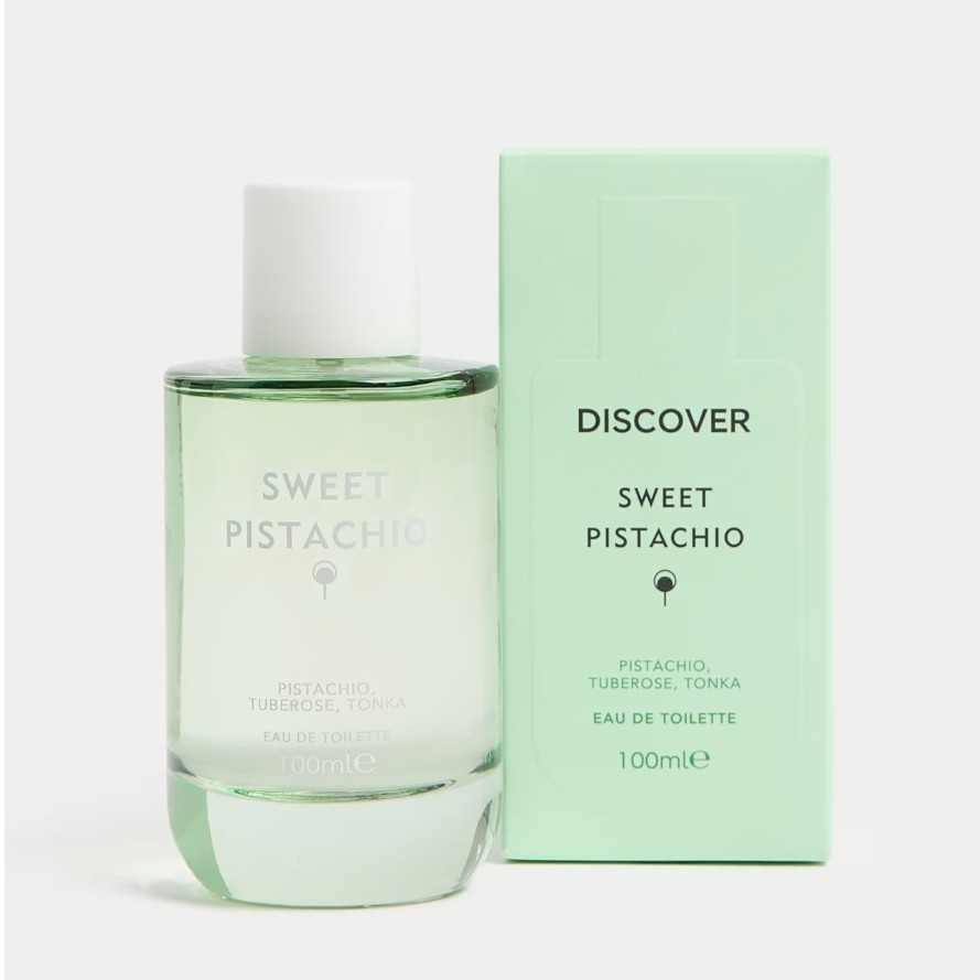 A bottle of Sweet Pistachio eau de toilette stands next to its mint green box, both labeled with scent notes of pistachio, tuberose, and tonka, 100ml size.