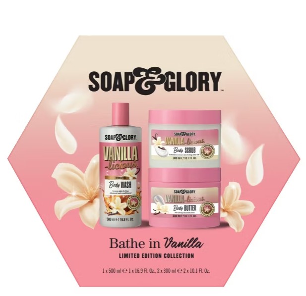 soap and glory gift set Soap & Glory Bathe in Vanilla limited edition set featuring body wash, body scrub, and body butter, displayed with vanilla flowers and a pink background.