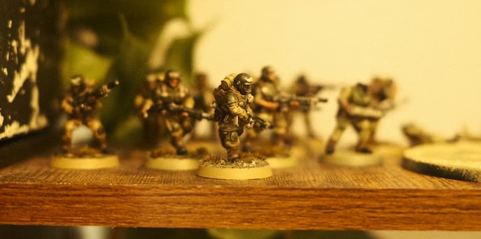 Astra Militarum Warhammer 40k A group of Astra Militarum Imperial Guard soldiers from Warhammer 40k, painted in green