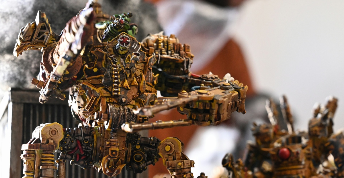 Warhammer 40k battle A group of walkers in a Warhammer 40k battle