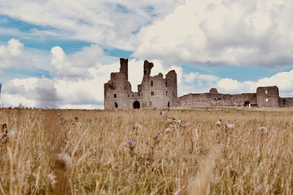 Dunstanburgh Castle in Northumberland, where you can often use your free National Trust pass to get entry