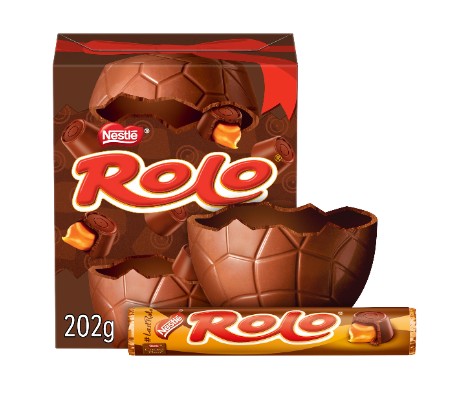 Box of Nestlé Rolo featuring a large chocolate egg, some pieces broken to show caramel filling, and a Rolo chocolate roll in front.